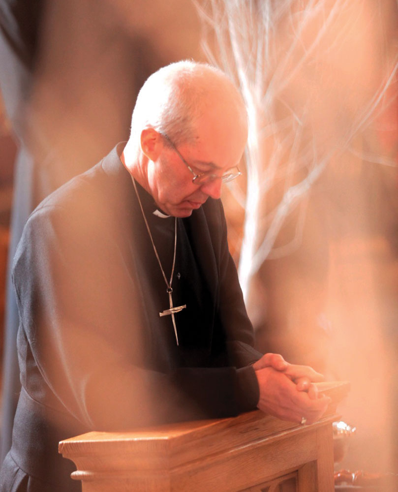 archbishopjustin-in-prayer-at-norwich-cathedral-in-2013