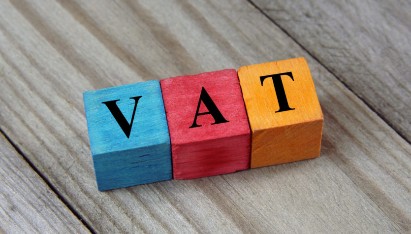 VAT text (Value Added Tax) on colorful wooden cubes