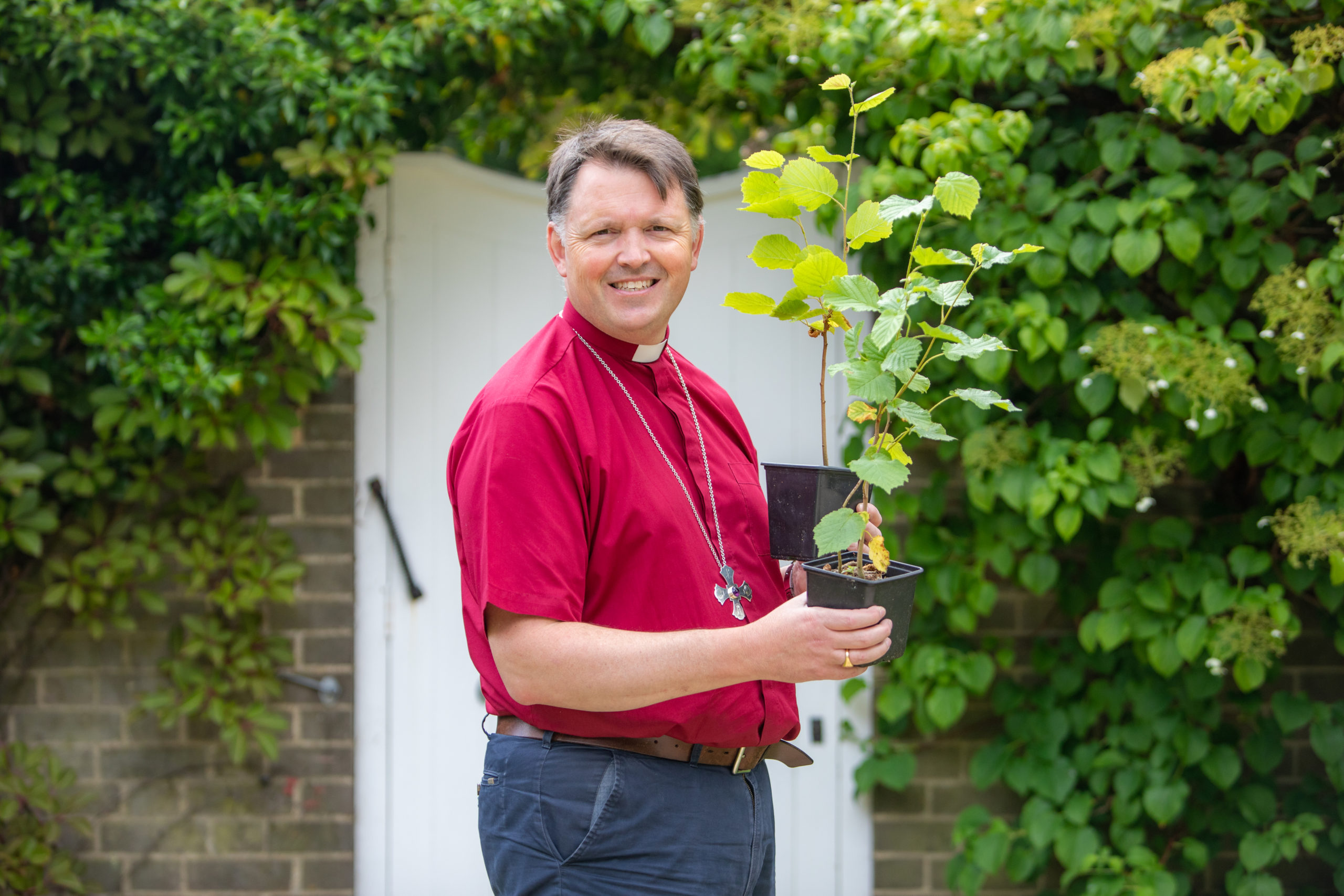 Every candidate that Bishop Graham confirms receives a hazel tree to plant.
