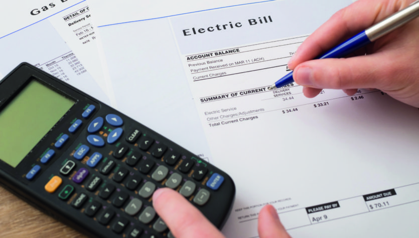Electric bill charges paper form on the table