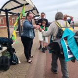 Passing the bottle of seawater along the relay