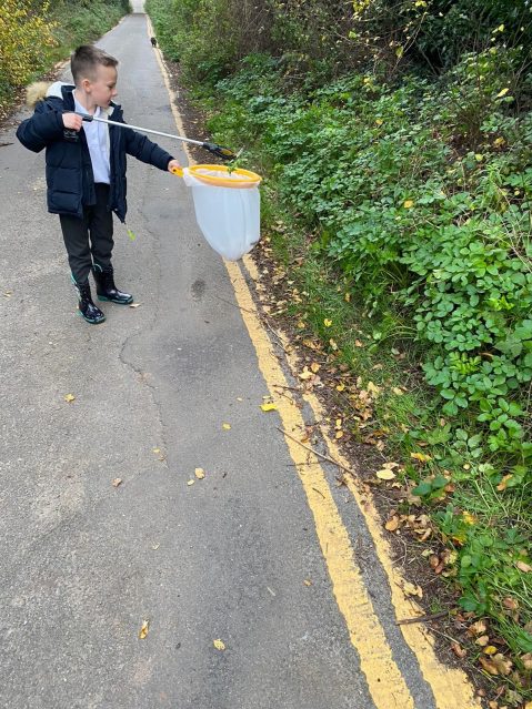 Max Leuty in Year 2 litter picking to raise funds for children in Ukraine Credit DNEAT