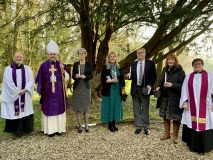 Confirmands with their candles and hazel saplings