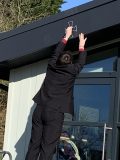 Dedicating the new building with the symbol of a cross.