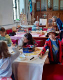 Children enjoying bee-themed crafts in Trowse