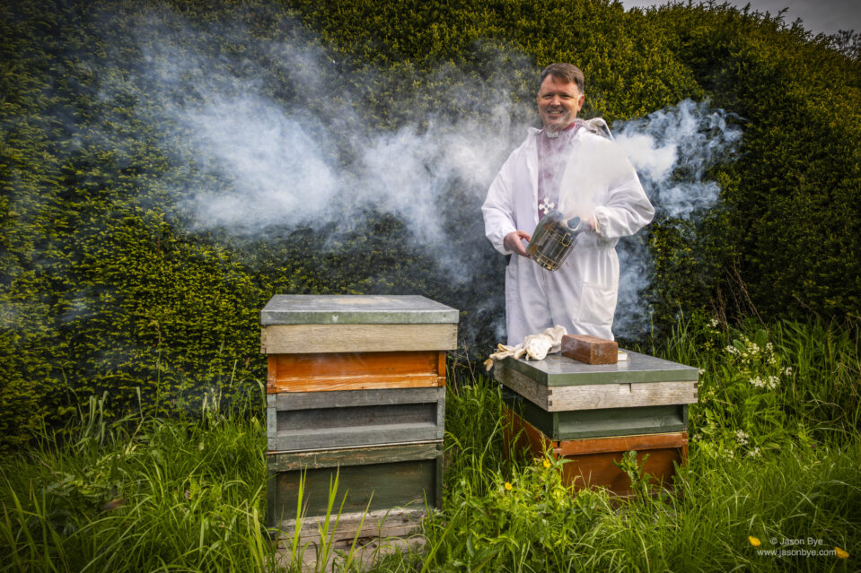 Bishop Graham tends to his bee hives in the garden of the Bishop’s House in Norwich, Photo (c) Jason Byewww.jasonbye.com
