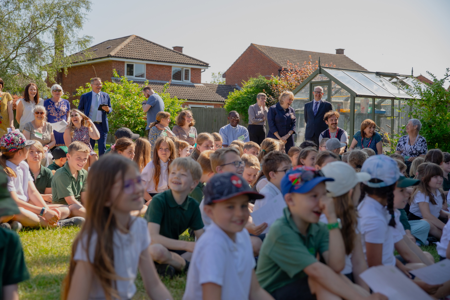 Children sitting in outside assembly