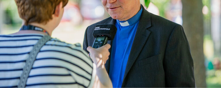 Bishop Ian Bishop being interviewed by BBC Radio Norfolk