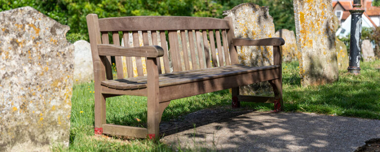 Wooden bench in a churchyard