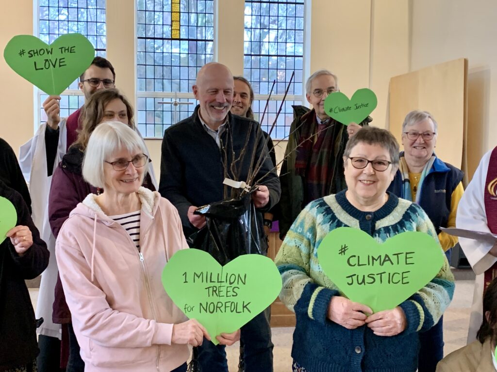 Crossroads Earlham congregation holding green hearts for #ShowTheLove 