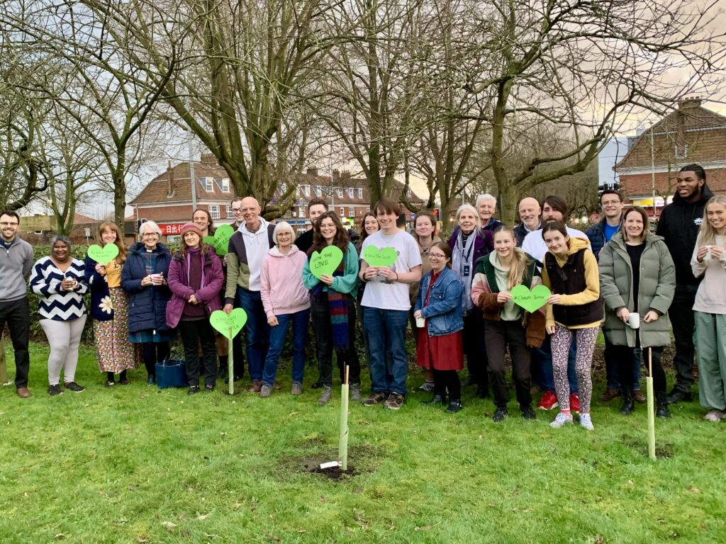 Crossroads Earlham congregation outside planting a tree for #ShowTheLove 