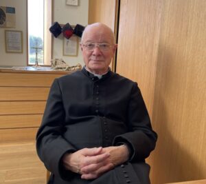 A picture of Christopher Davies sitting down in an office.